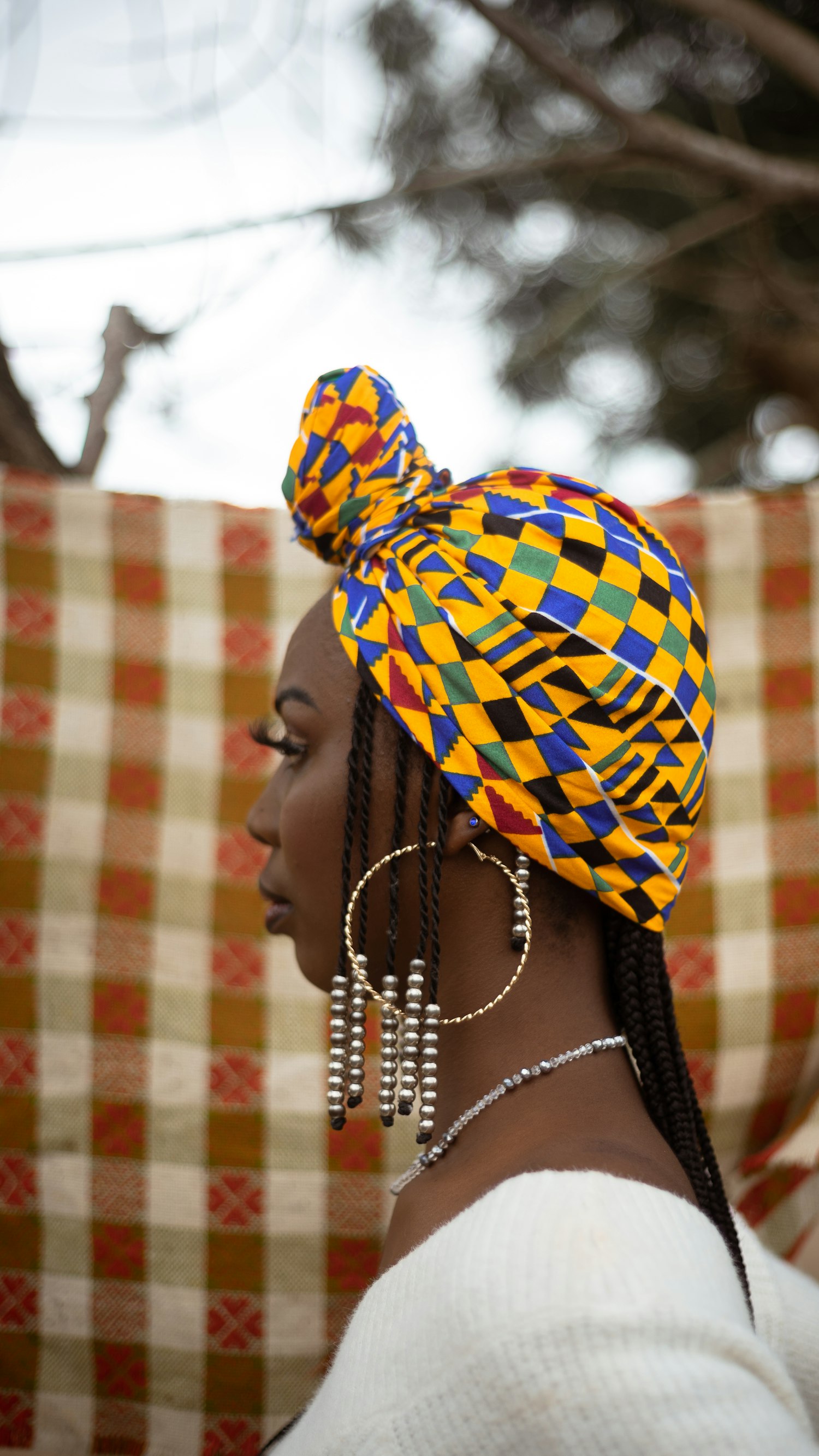 A woman in a kente headwrap